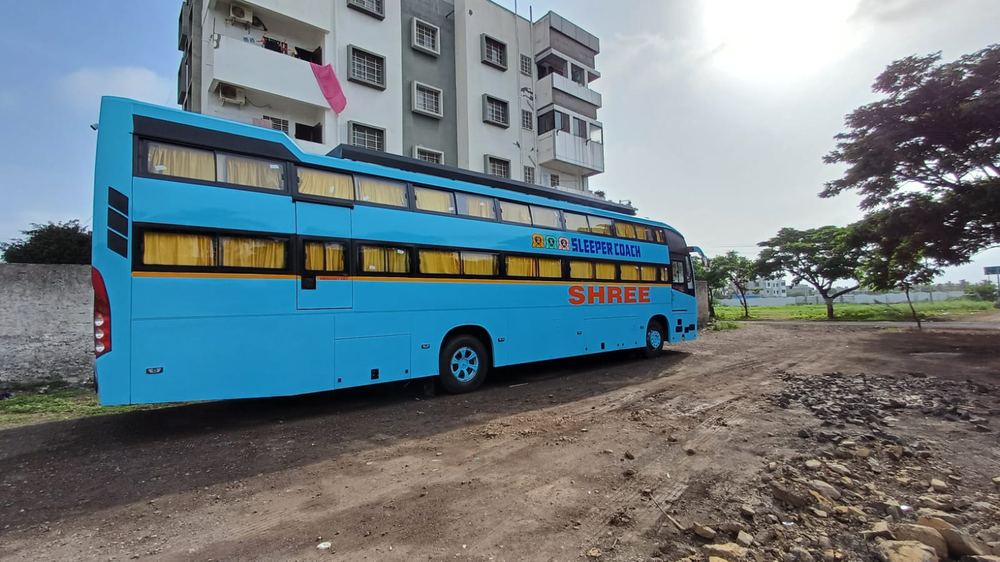 Shree Travels double-decker sleeper coach parked in Ahmednagar